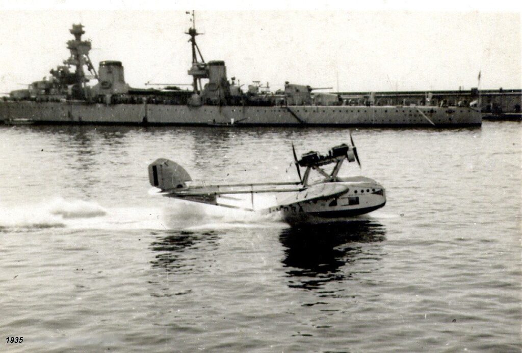 Savoia-Marchetti S.55 landing on water near the Italian heavy cruiser Trento