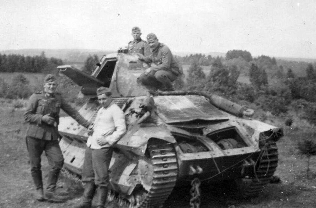 Wehrmacht soldiers next to a FCM 36 tank