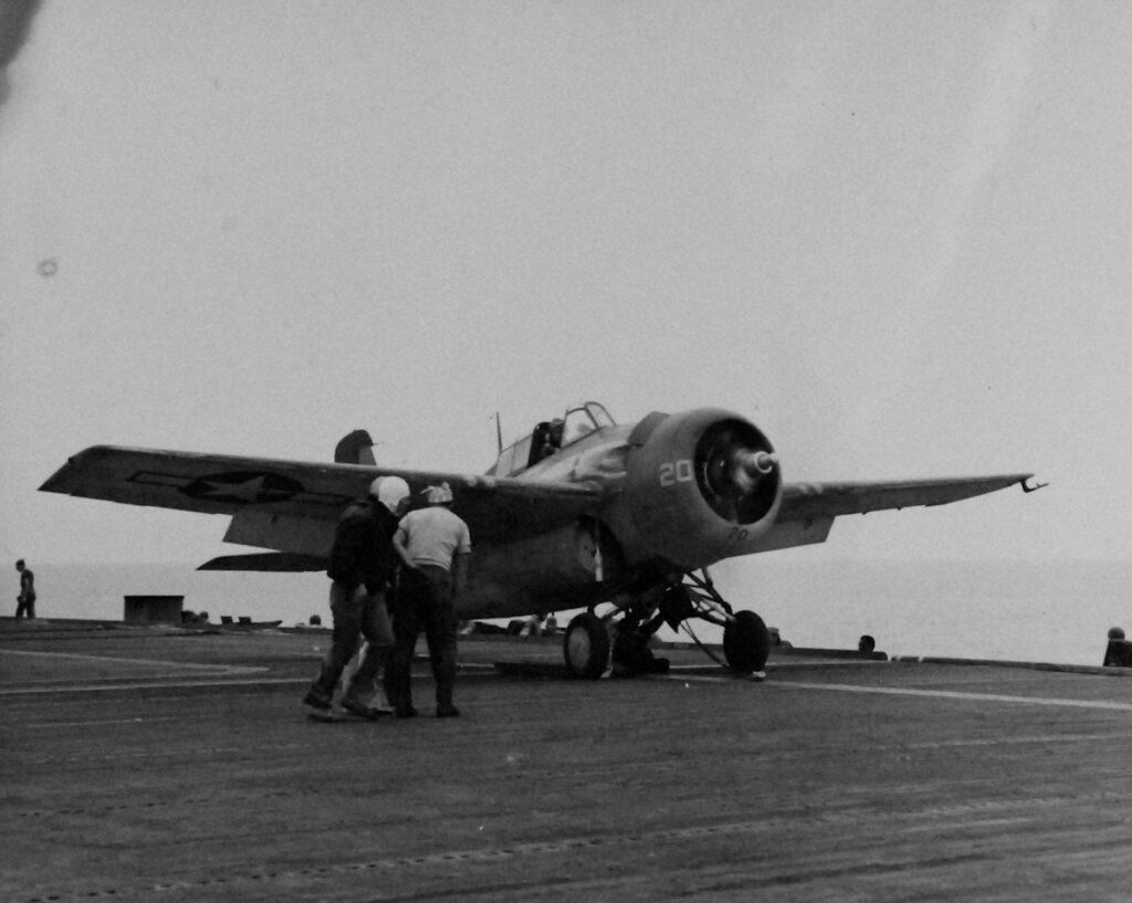 An FM-2 Wildcat fighter preparing for launch aboard USS Matanikau (CVE-101) 27 July 1944