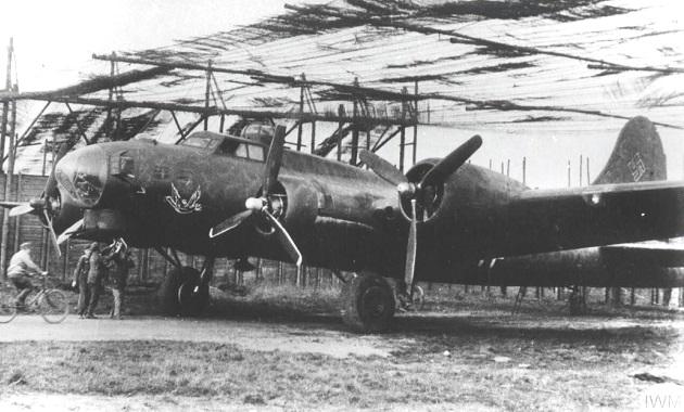 Boeing B-17G of I.KG 200 under camouflage netting on Wackersleben air field in Germany during 1945