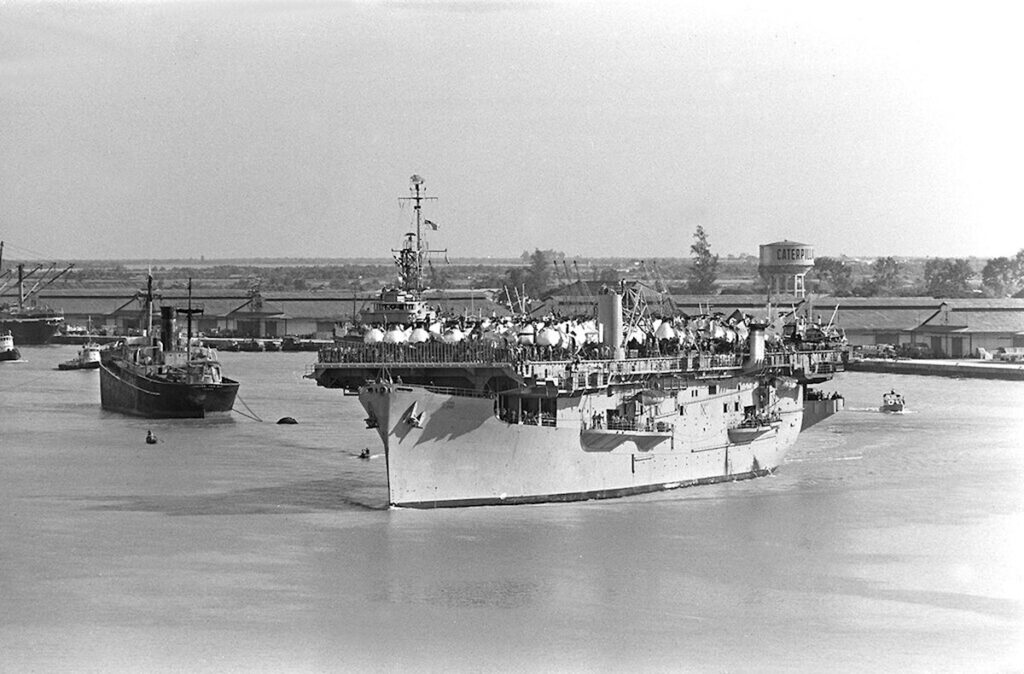 USNS Core (T-AKV 41) in Saigon 1961 with 32 H-21 Shawnee helicopters