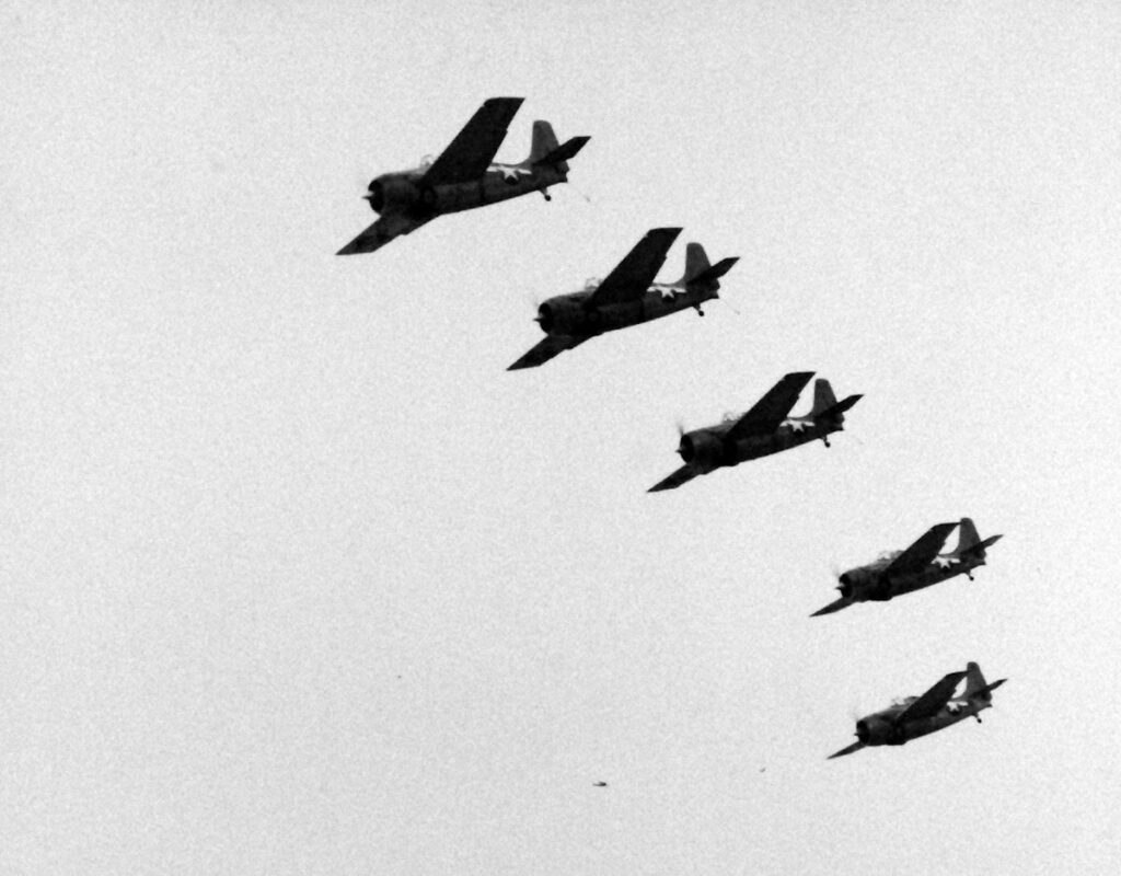 FM-2 Wildcats flying in formation. Aircraft from USS Matanikau (CVE-101), circa 1944