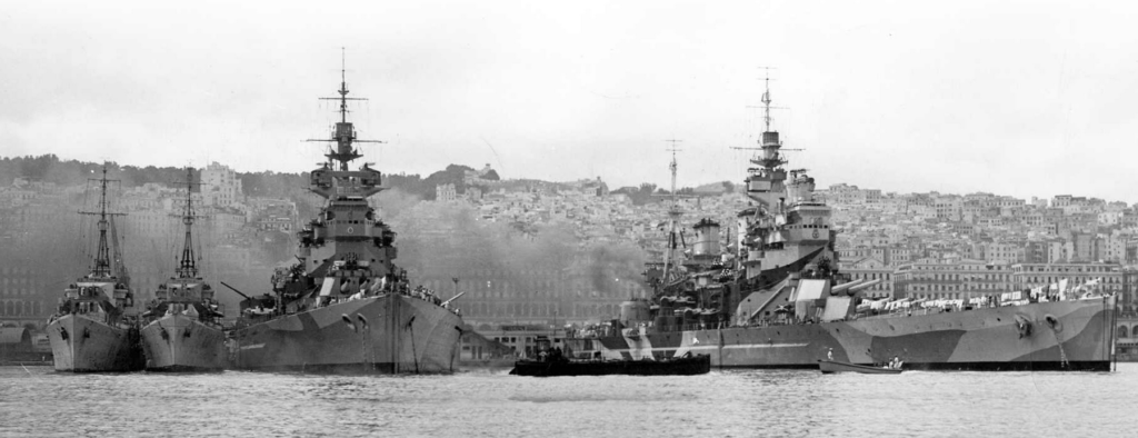 HMS King George V alongside her sister HMS Howe in July of 1943, Algiers