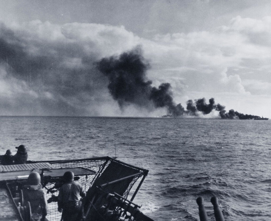 Possibly USS Gambier Bay (CVE-73), attacked by Japanese surface units, as seen from USS White Plains (CVE-66)