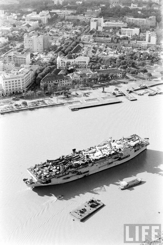 USNS Core (T-AKV 41) in Saigon River 1961