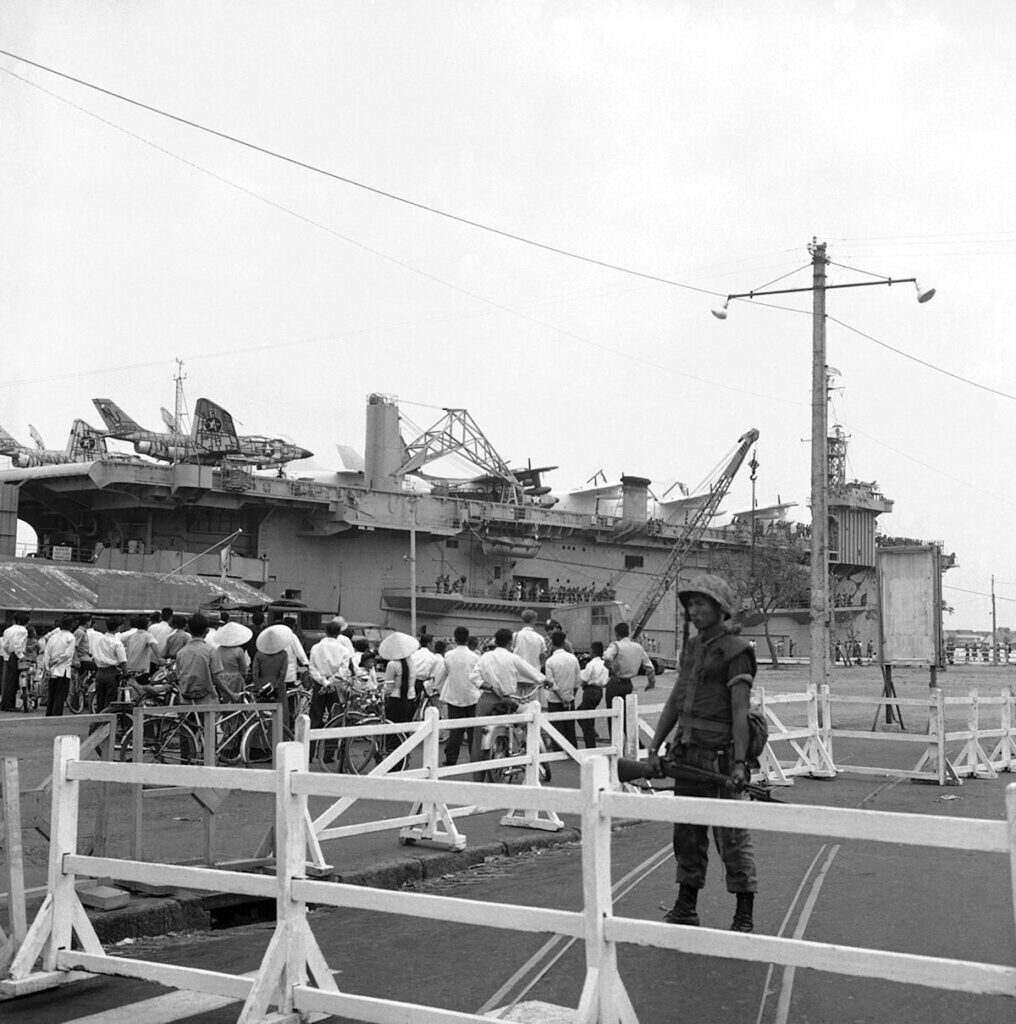 USNS Core (T-AKV-41) docks in Saigon Feb. 7, 1962