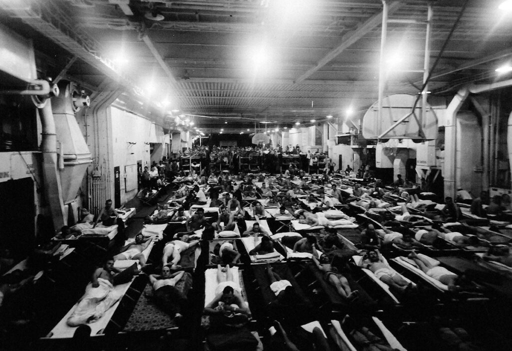 Servicemen returning to the United States from the Pacific aboard USS Salamaua (CVE-96)