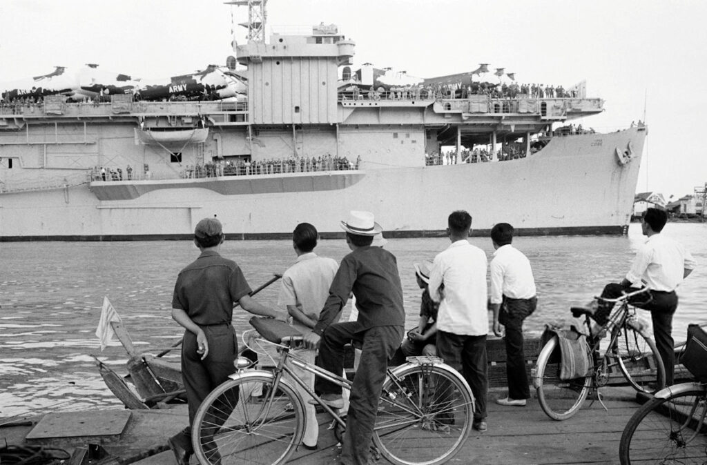 USNS Core (T-AKV 41) docks at Saigon harbor, South Vietnam