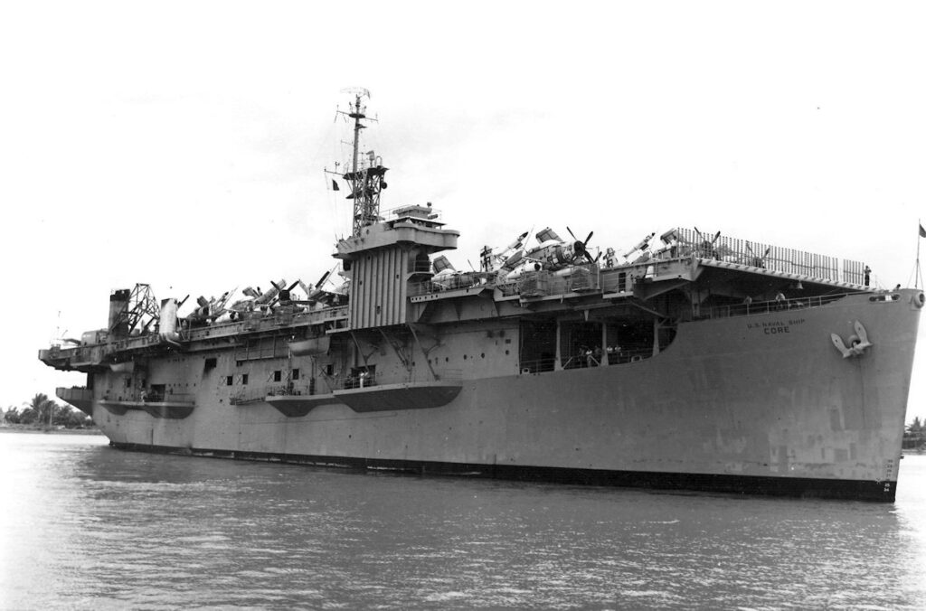 USNS Core (T-AKV 41) in Saigon Harbour 17 June 1965 with more than 70 Douglas EA-1F Skyraiders for the Vietnamese Air Force