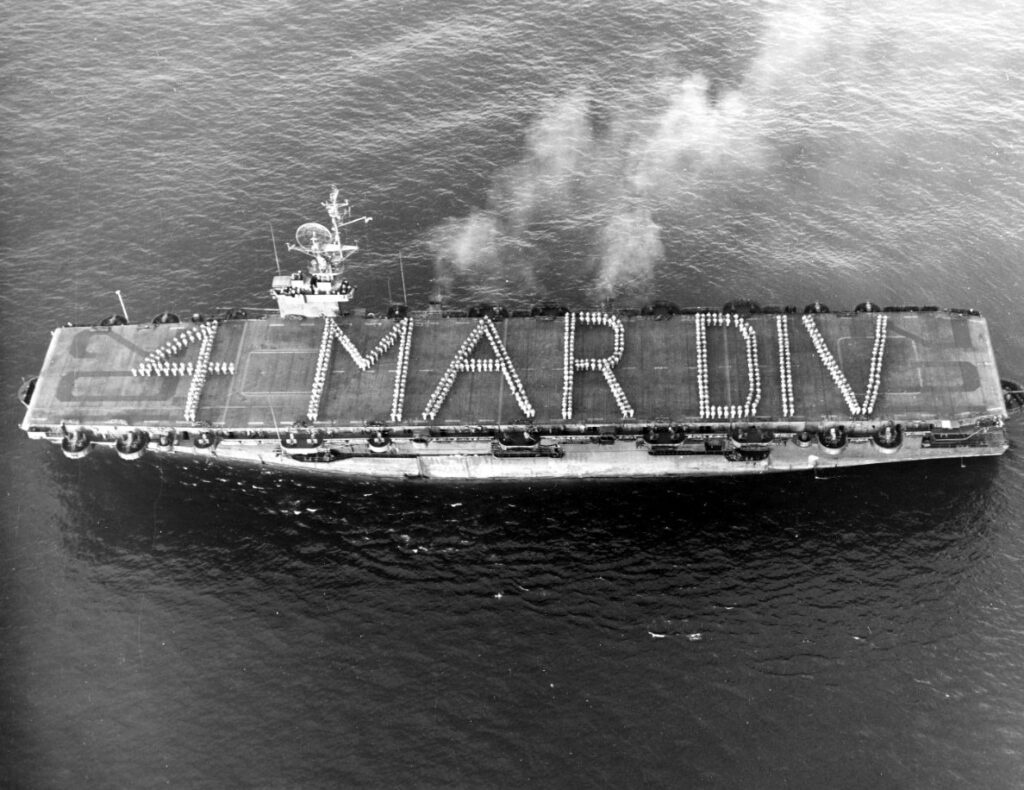 USS Attu (CVE-102) arrives at San Diego, California, at the end of a magic carpet transport run, transporting the US 4th US Marine Division on 12 October 1945