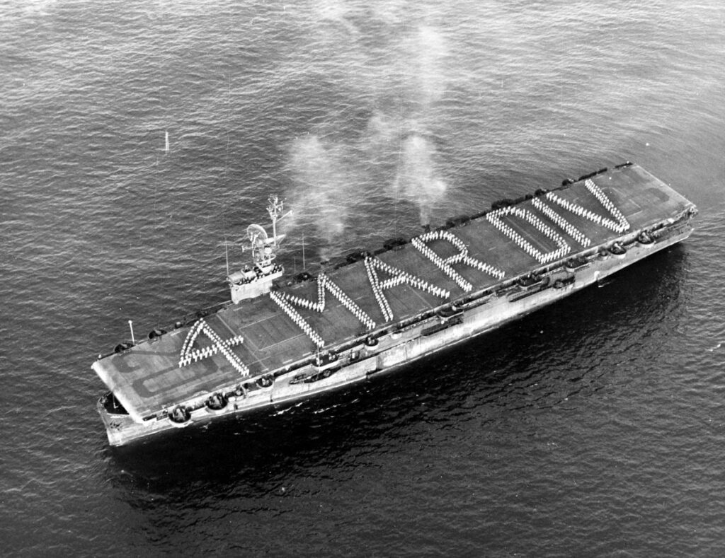 USS Attu (CVE-102) arrives at San Diego, California, at the end of a magic carpet transport run, transporting the US 4th US Marine Division on 12 October 1945