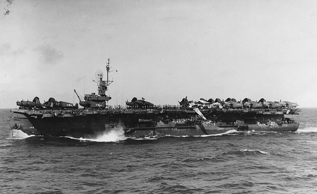 USS Attu (CVE-102) underway in the western Pacific, after passing through a typhoon on the morning of 5 June 1945