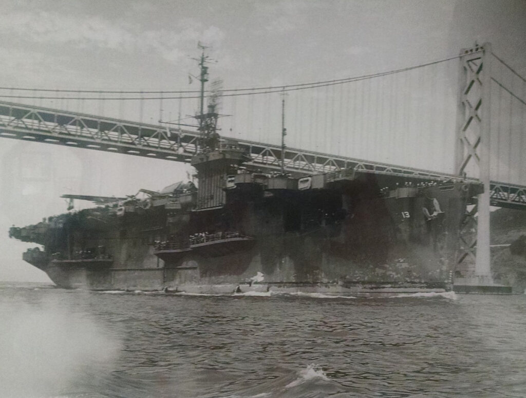 USS Core (CVE-13) ferrying aircraft steamed under the San Francisco-Oakland Bay Bridge possibly 3 September 1945