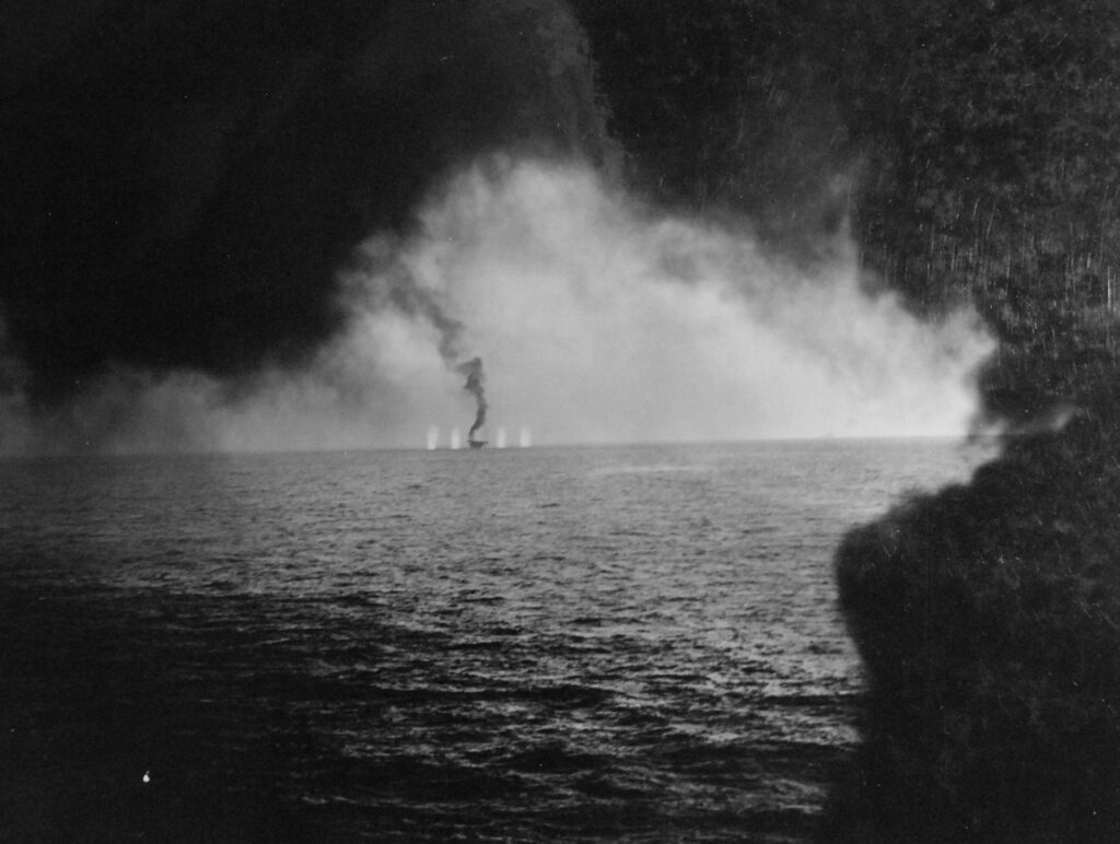 USS Gambier Bay (CVE-73) bracketed by shells