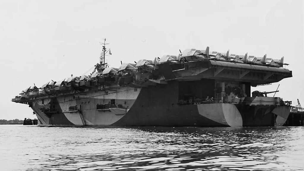 USS Gambier Bay (CVE-73) in port, April 1944. The ship is painted in Camouflage Measure 32, Design 15A