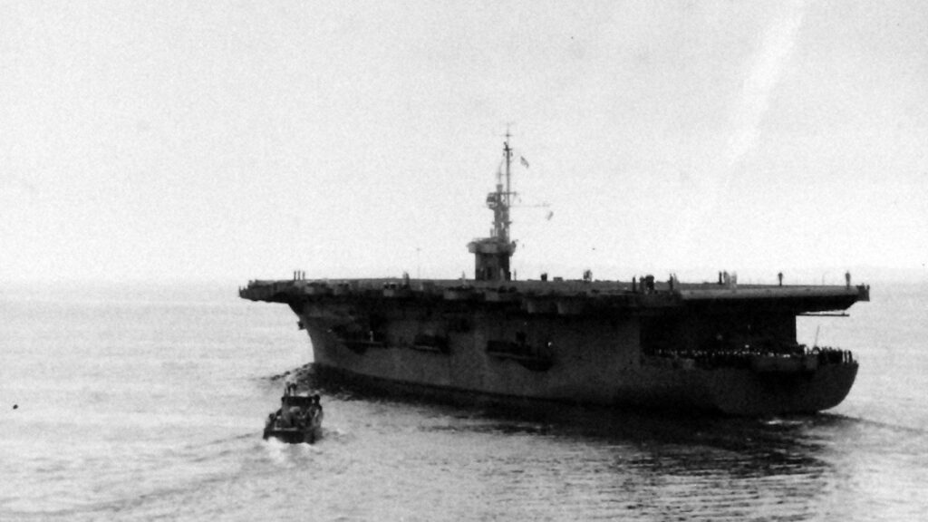 USS Matanikau (CVE-101), pilot house boat approaches, taken on 13 July 1944