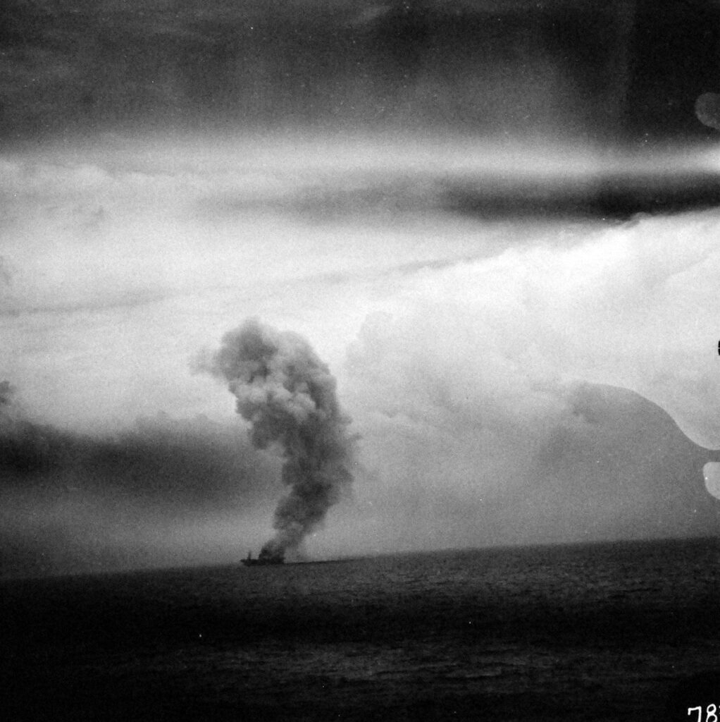 USS St. Lo (CVE-63) burning As seen from USS Kitkun Bay (CVE-71)