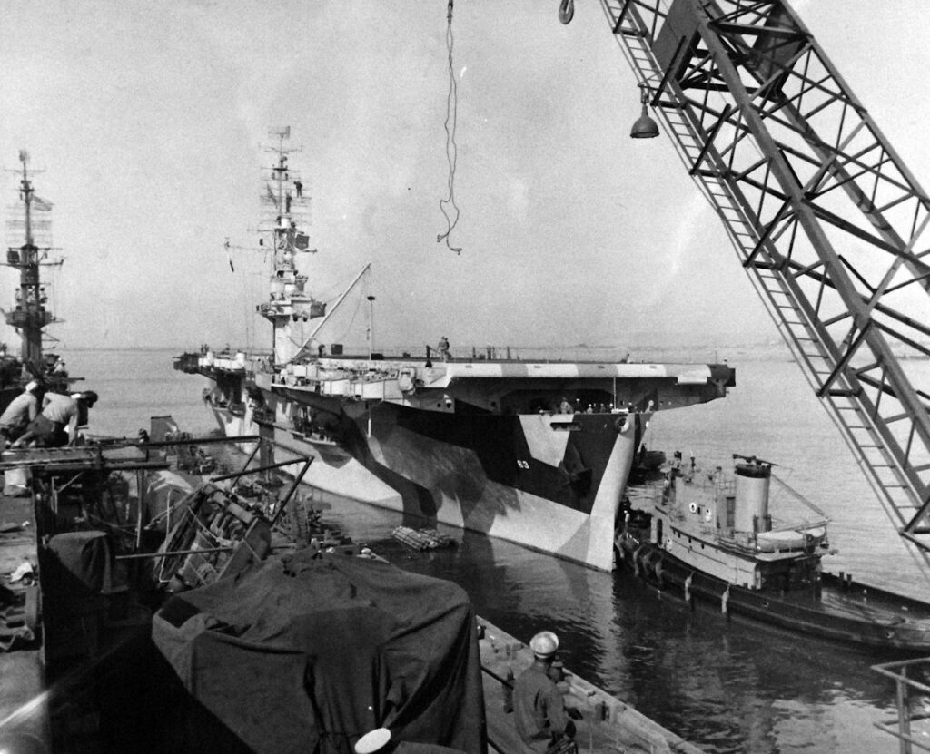 USS Midway (CVE-63) leaving the destroyer base at San Diego, 10 April 1944, as seen from USS White Plains (CVE-66)