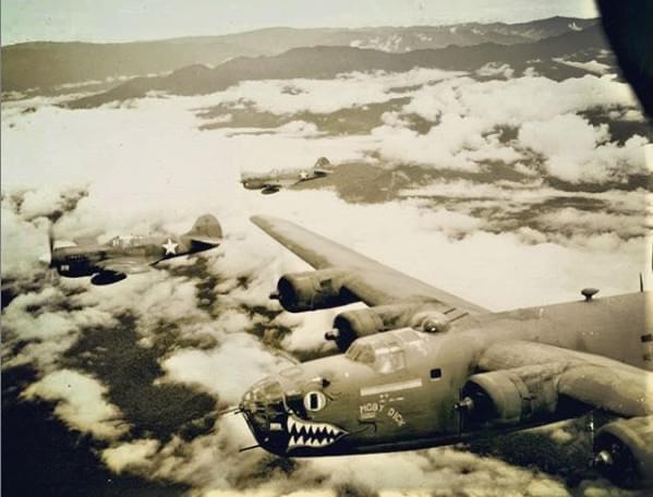 B-24D-15-CO Liberator 41-24047 Moby Dick of the 320th BS/90th BG, 5th AF, flies alongside two Curtiss P-40 Warhawk escorts