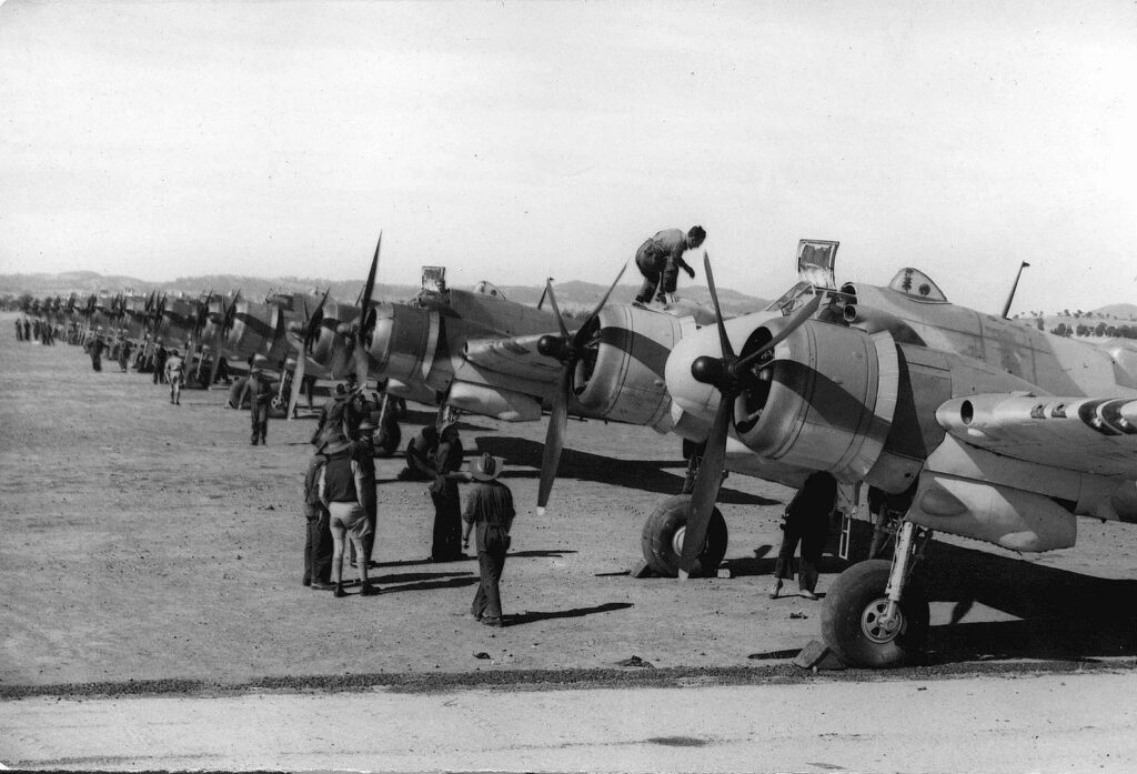 Bristol Beaufighters of No 31 Squadron RAAF with fitters doing their daily inspections at RAAF Base Forest Hill