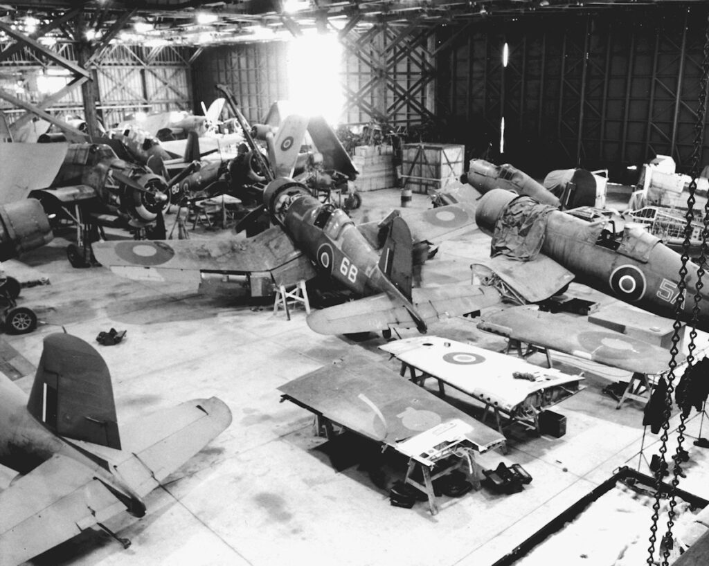 Royal Navy Fleet Air Arm Grumman Avenger and Vought Corsair aircraft in Hangar 3 at Naval Air Station Brunswick, Maine (USA), in 1944.