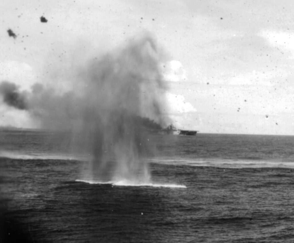 USS Franklin (CV-13) underway in Task Group (TG) 38.4 after being hit by a Zero kamikaze