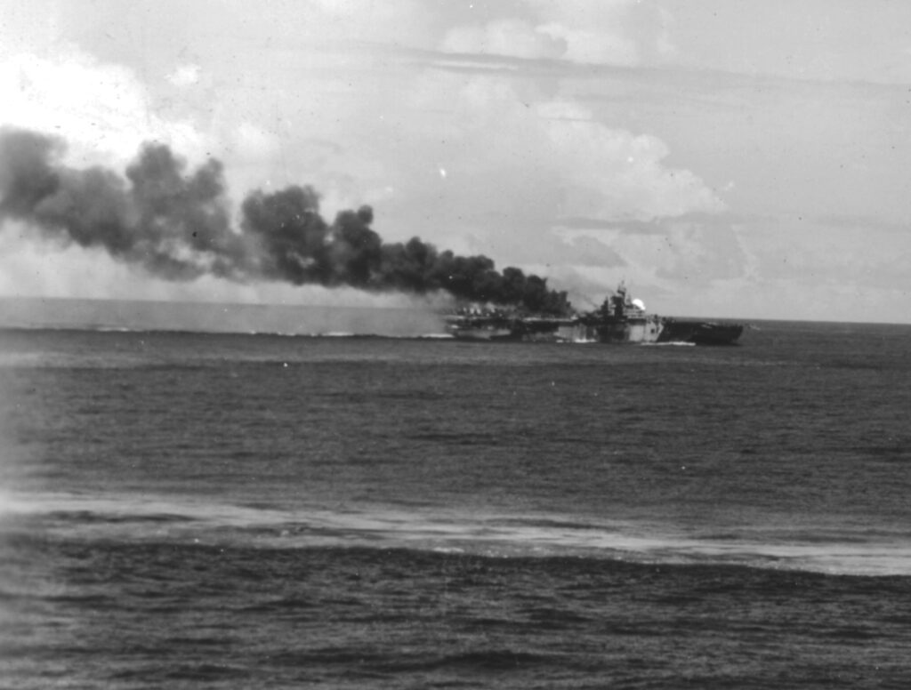 USS Franklin (CV-13) underway in Task Group (TG) 38.4 after being hit by a Zero kamikaze