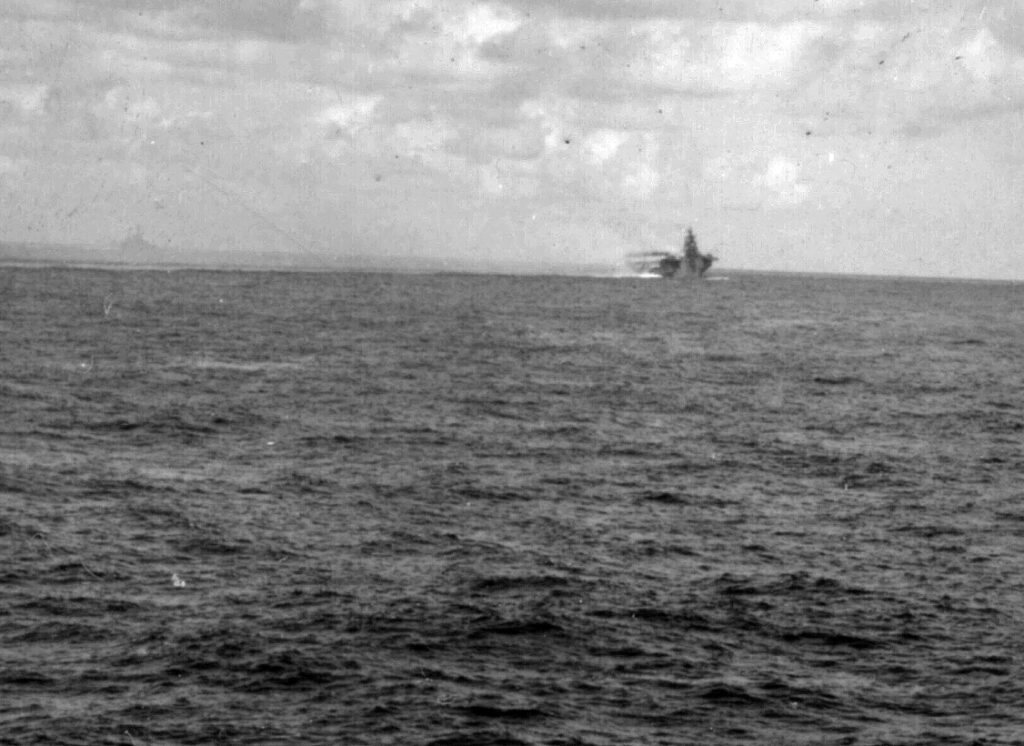 USS Franklin (CV-13) underway in Task Group (TG) 38.4 after being hit by a Zero kamikaze