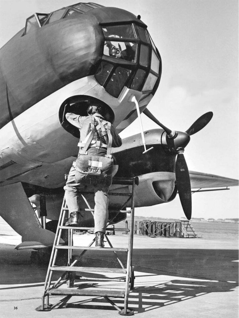 The pilot climbing into the Ju.86P-1 pressurized cabin