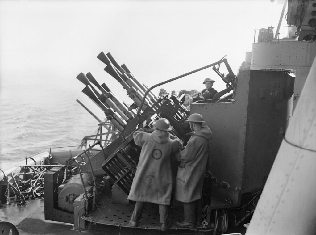 HMS Howe Gun crew at one of the eight barrelled Vickers two pounder mark VIII 'pom-pom' guns