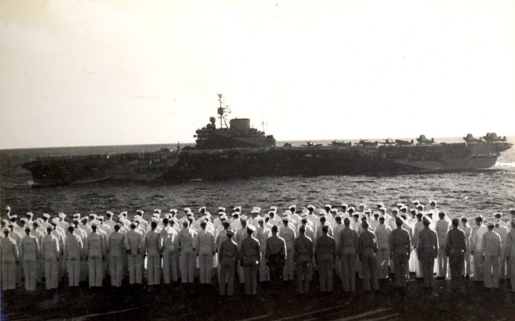 HMS Illustrious (87) steaming past the USS Saratoga (CV-3) in the Indian Ocean, 18 May 1944