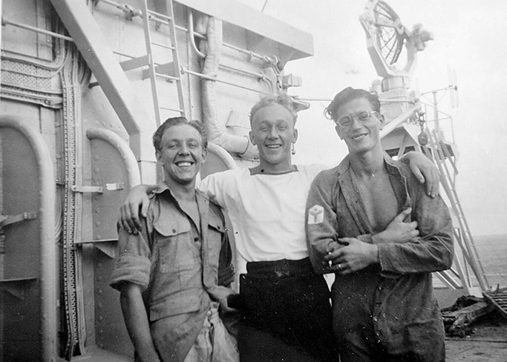 Crew on Vindex's flightdeck, 20 April 1946, at Sydney, show the 2nd tower added behind Vindex's main tower in 1945