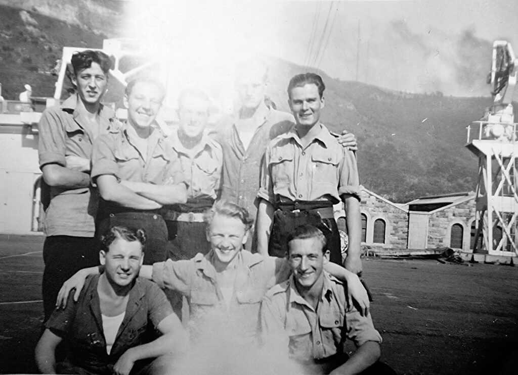 Crew on Vindex's flightdeck, 20 April 1946, at Sydney, show the 2nd tower added behind Vindex's main tower in 1945