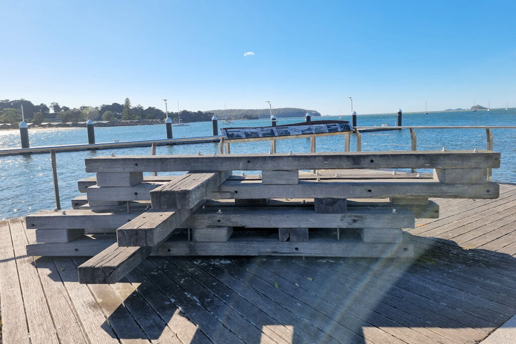 Seating and information board on the foreshore Batemans Bay Sculpture Walk