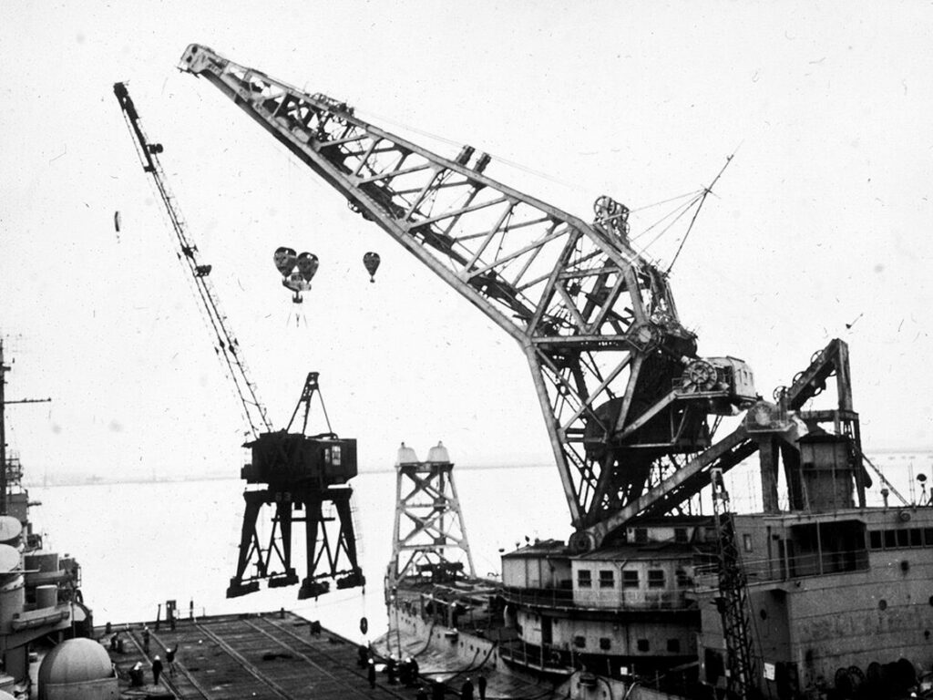 Crane Ship No. 1 lifting a 120 ton crane from South Boston in November, 1948