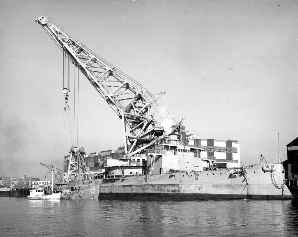 The raised trawler Lynn is seen alongside U.S. Crane Ship No. 1 5 September 1952