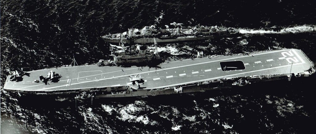 HMCS Bonaventure (CVL 22), with HMCS Iroquois escorting