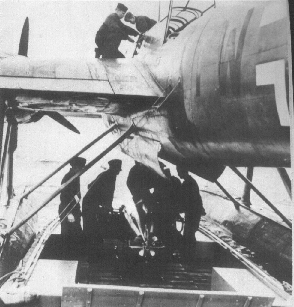 Loading a torpedo onto a Heinkel He 115