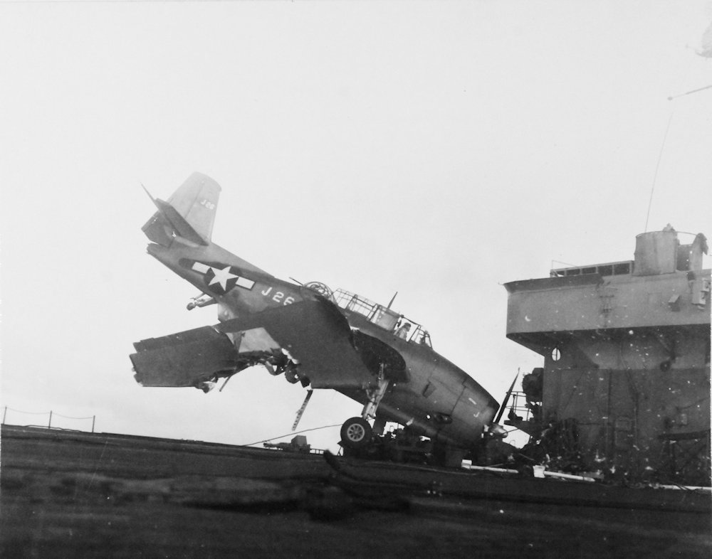 USS Altamaha (CVE-18). Crash landing of a Grumman TBM Avenger (J26 of VC-66 ) due to tail hook failure