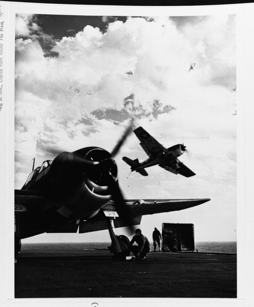 Grumman F6F Hellcat prepares to take off from USS NASSAU (CVE-16), October 1943