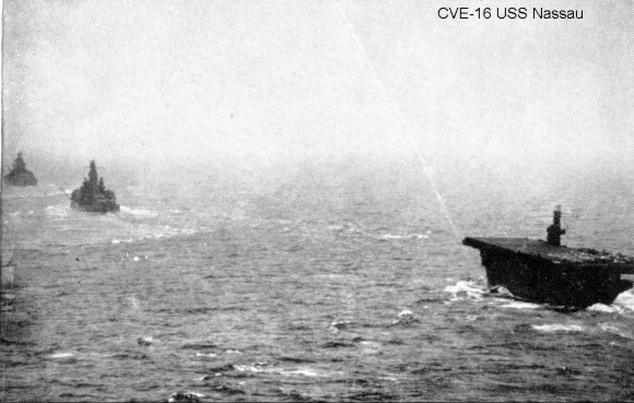 USS Nassau (ACV-16) steaming astern of battleships USS Pennsylvania (BB-38) and USS Idaho (BB-42). Attu occupation, May 1943