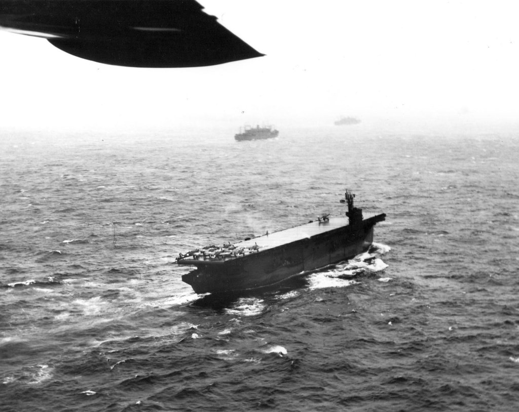 USS Nassau (ACV-16) underway and rolling to port in moderate seas during the invasion of Attu, May 1943