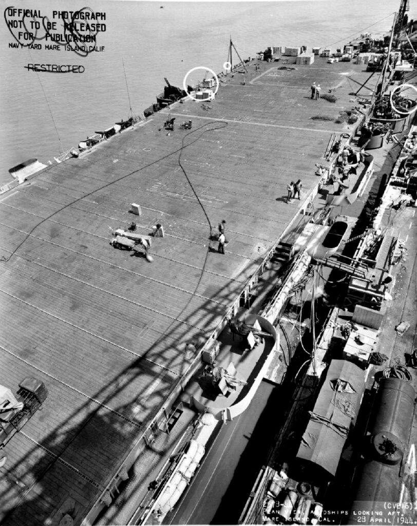 USS Nassau (CVE-16), looking aft, Mare Island Navy Yard, 28 April 1944. Circles mark recent alterations