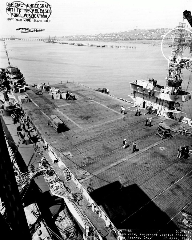 USS Nassau (CVE-16), looking forward, Mare Island Navy Yard, 28 April 1944. Circles mark recent alterations